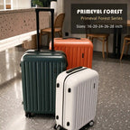 Three suitcases in green, orange, and white on a floor with 'Primeval Forest' branding.