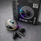 A pair of black wireless earbuds and a matching charging case with RGB lighting are shown in front of their product box on a gray textured surface. The box is branded MIBIESCAT and features Chinese text.