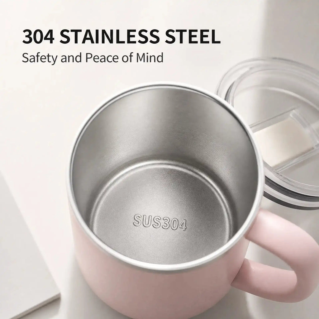 A pink stainless steel mug with a clear lid, shown on a light background with text reading '304 STAINLESS STEEL' and 'Safety and Peace of Mind.' The mug interior is visible, with 'SUS304' stamped on the bottom.